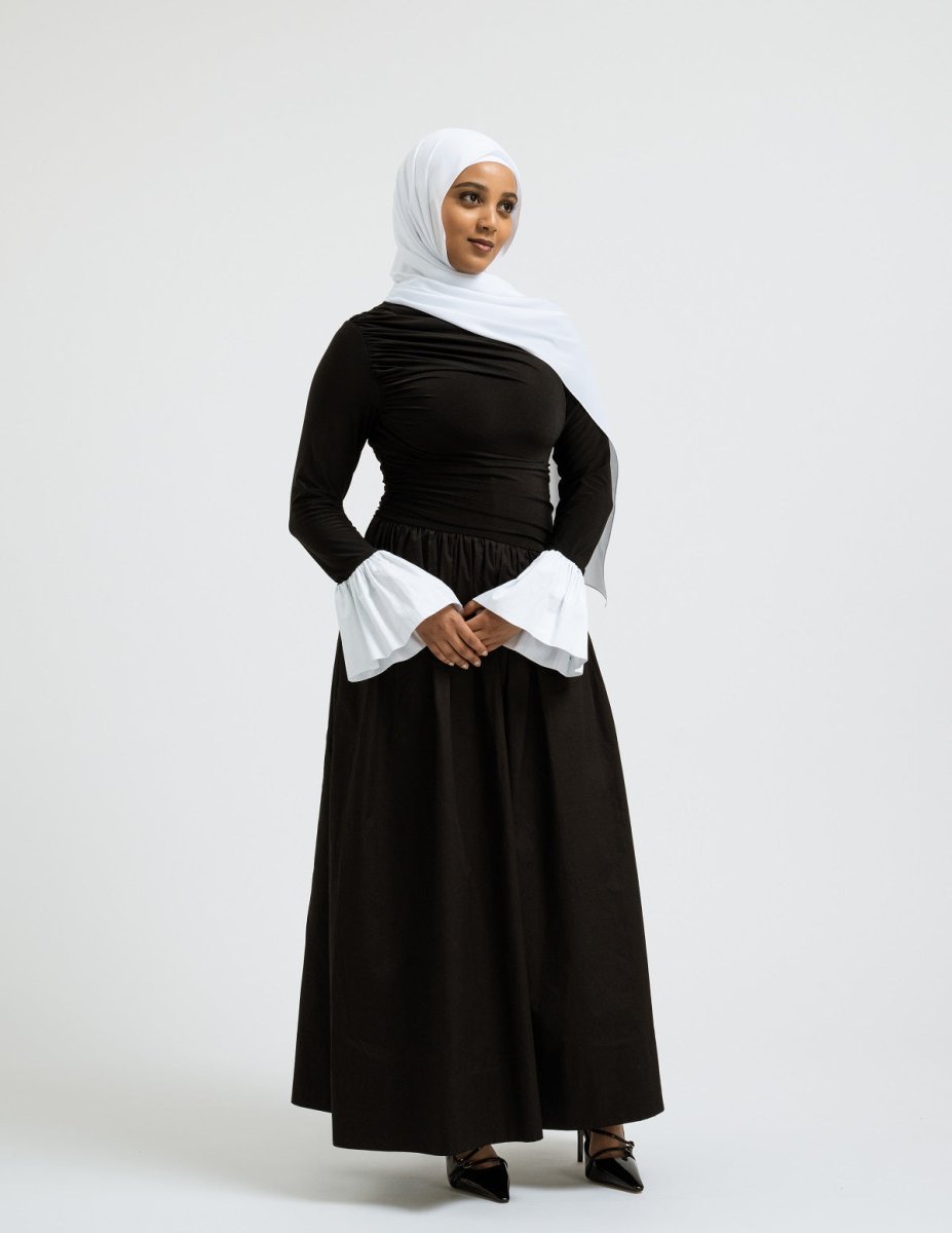 Modern modest woman wearing Luna dress with pleated bodice - Leyannaco