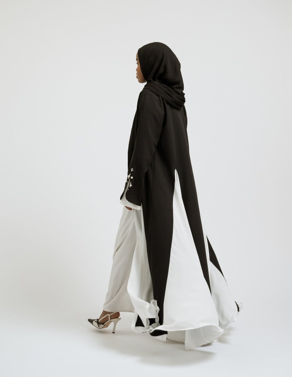 Modest woman wearing flowing Perla abaya with chiffon panels - Leyannaco
